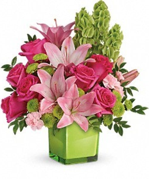 Fresh shades of green are a great way to contrast pink roses and lilies