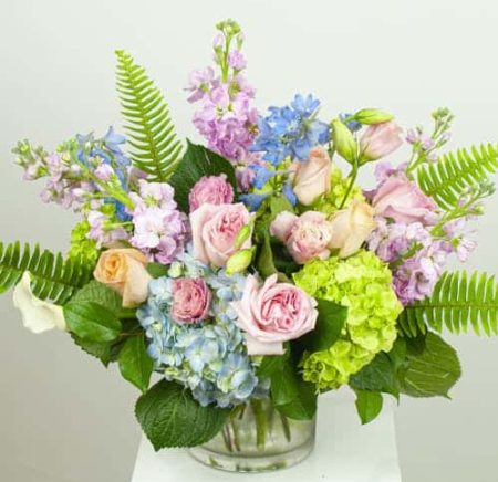 A garden of beautiful pastel blooms, including stock, garden roses, delphinium and other pastel blooms makes a perfect choice.