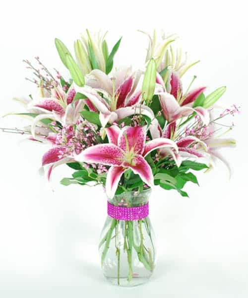 Simple and elegant, beautiful pink stargazer lilies hand designed in a vase.